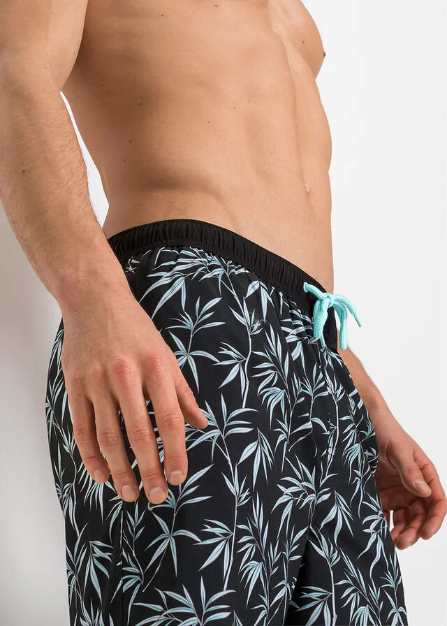 BAñADOR DE HOMBRE NEGROBLANCO DE FLORES