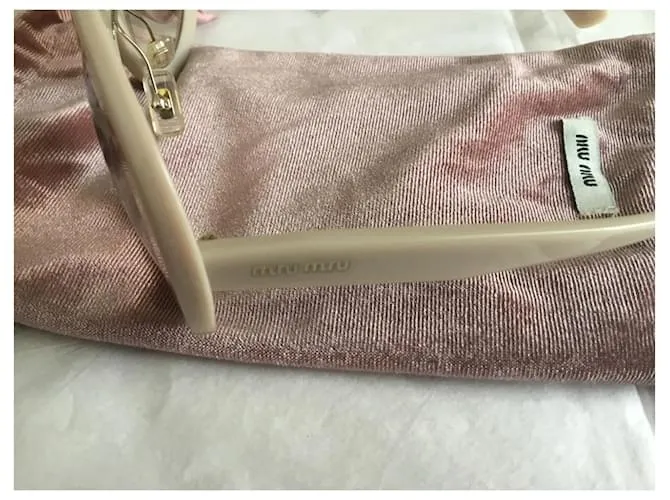 Miu Miu Lentes de sol Beige 