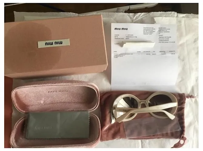 Miu Miu Lentes de sol Beige 