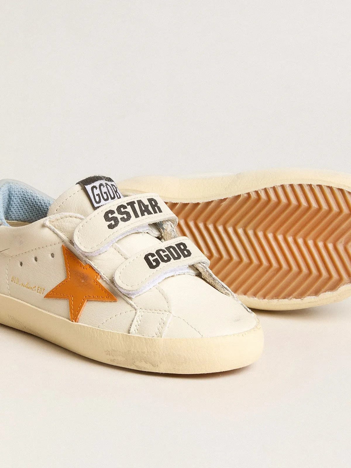 Old School Junior de piel con estrella naranja y refuerzo del talón azul bebé