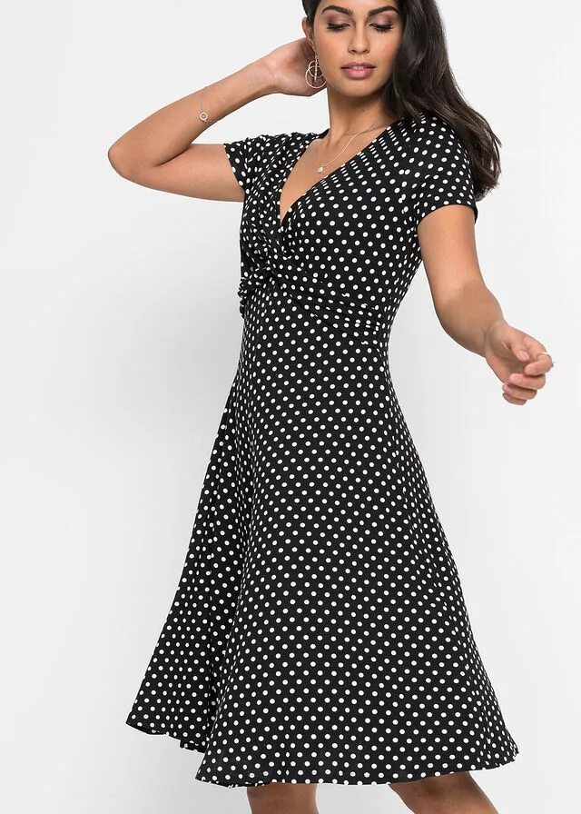 VESTIDO DE PUNTO DE VISCOSA SOSTENIBLE NEGROBLANCO DE LUNARES